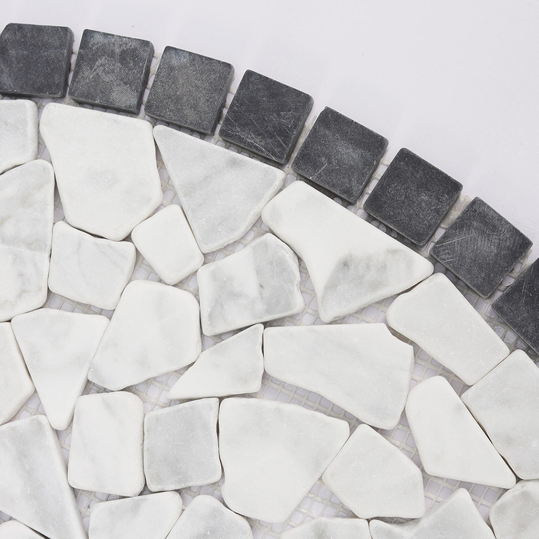 Detailed shot of the curved dark grey square border and white pebble stone mosaic texture.