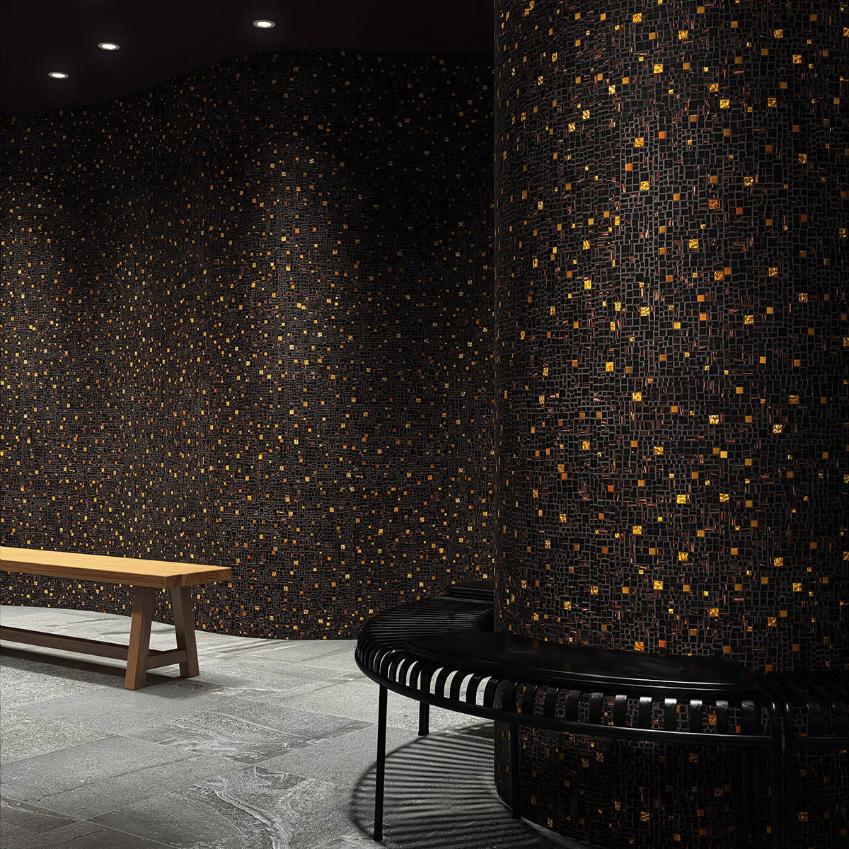 Curved black mosaic tile walls with gold highlights in a modern lounge setting