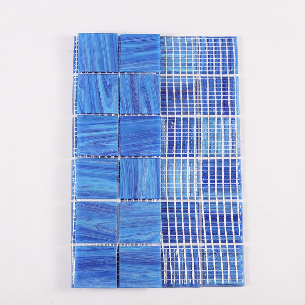 Back view showing mesh backing of dark blue glass mosaic tile sheet