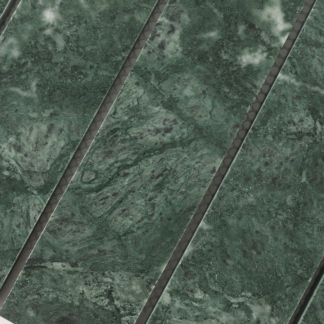 Detailed surface of dark green marble strips with layered natural stone patterns