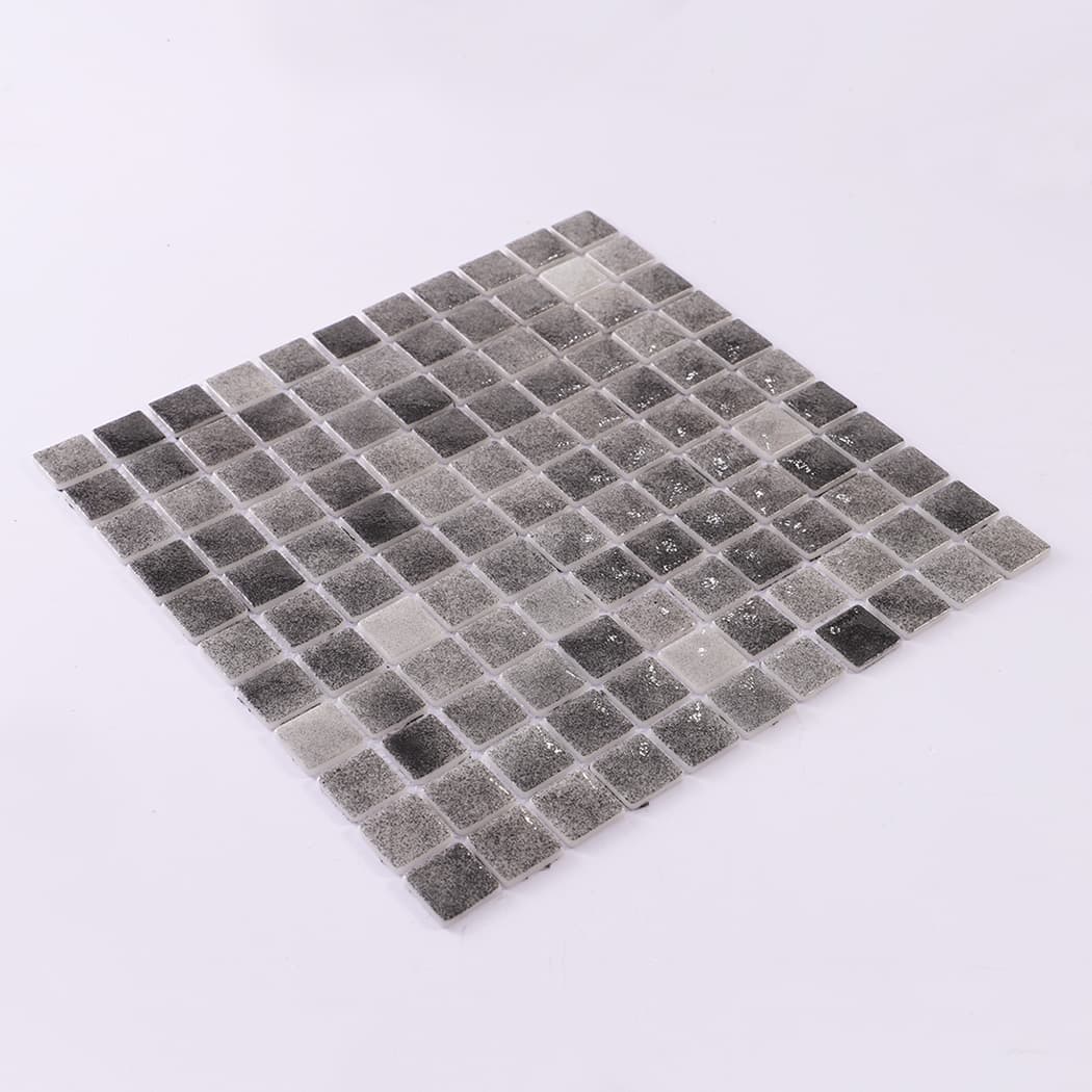 Angled view of dark grey recycled glass mosaic tile sheet