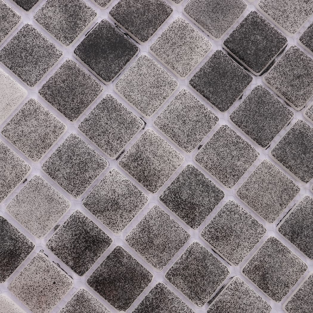 Texture close up of dark grey recycled glass mosaic tile surface