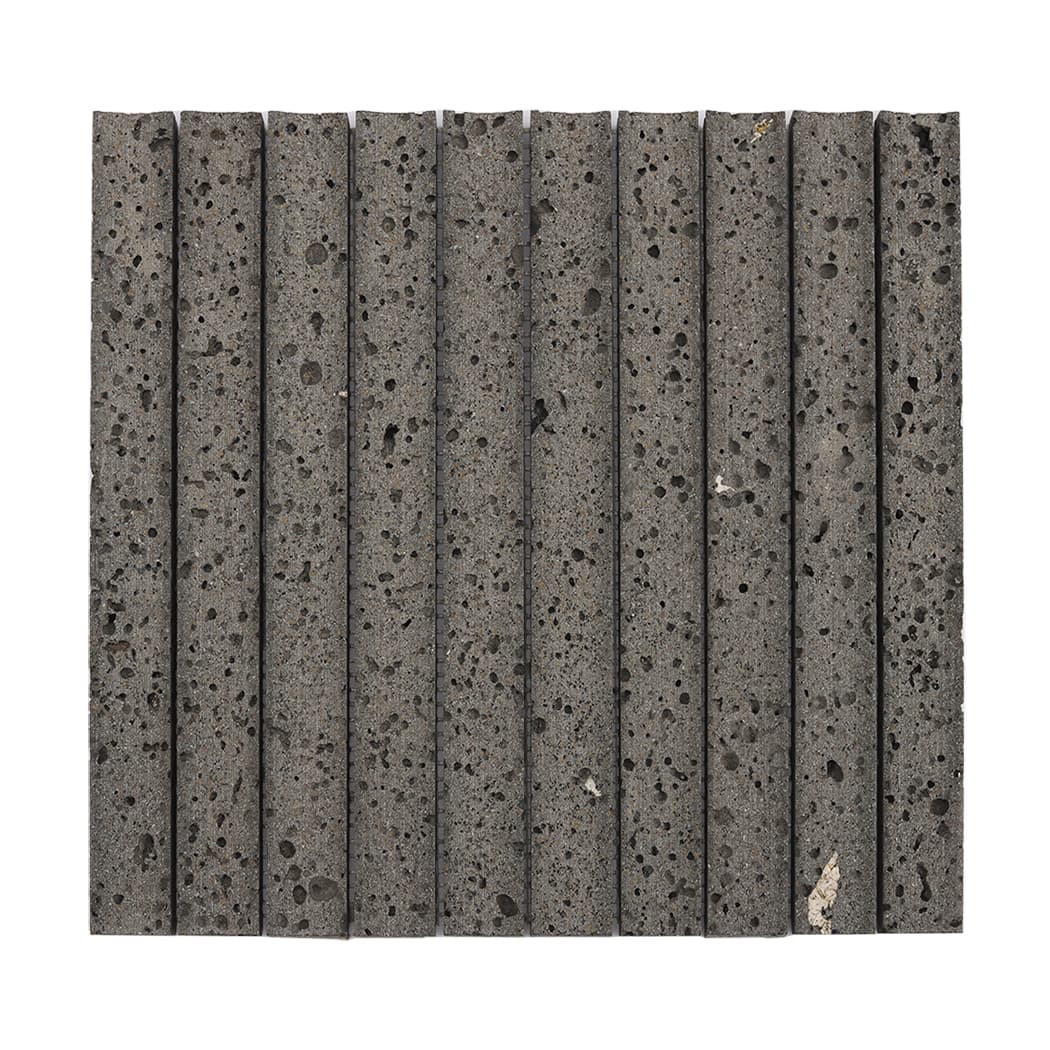 Full front view of a square dark gray basalt fluted mosaic tile sheet.