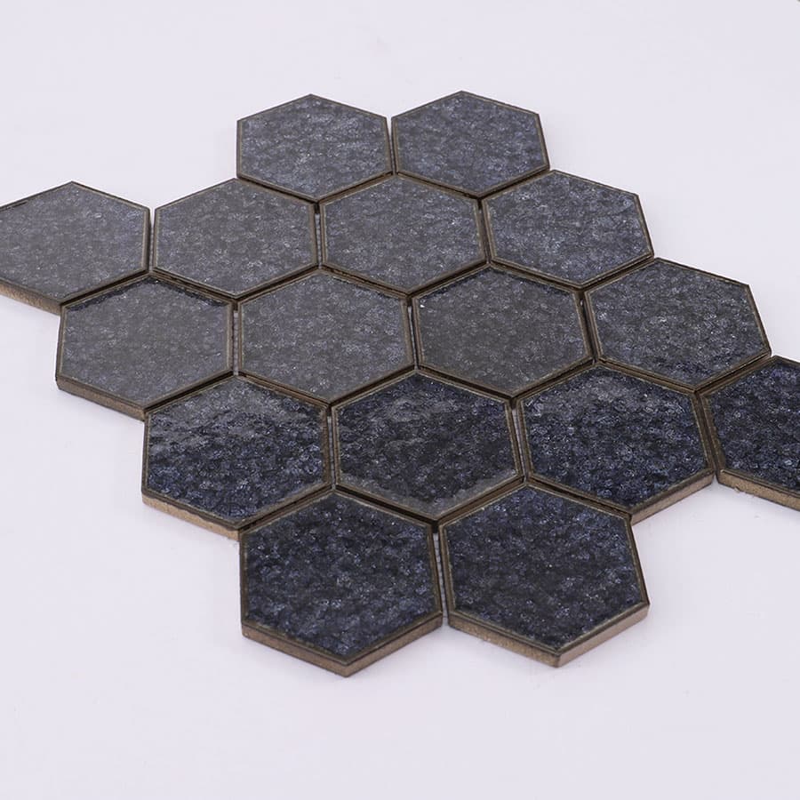Angled view of black hexagon crackle mosaic tile sheet