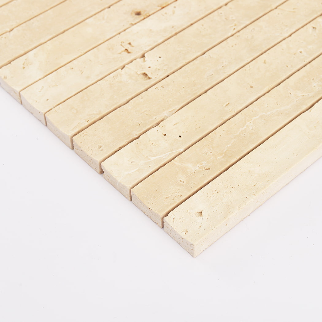 Close perspective of the fluted edges and porous texture of beige travertine.