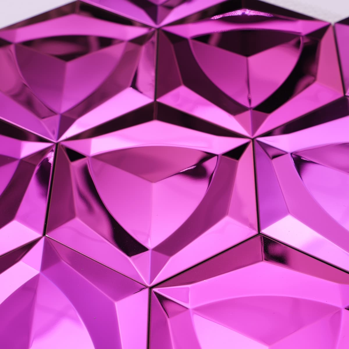 Close-up of shiny pink mirror stainless steel mosaic tiles