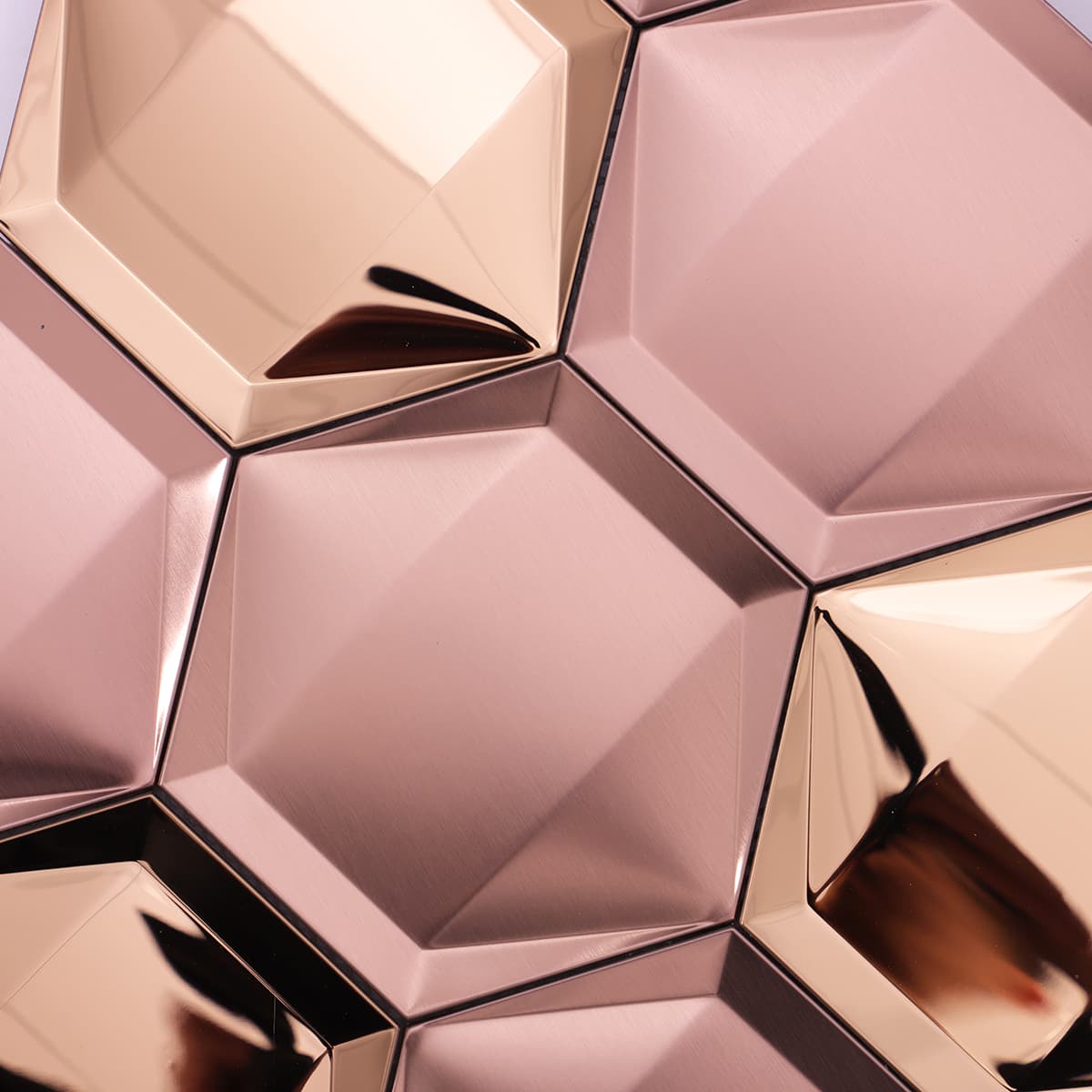Brushed rose gold metal tile with chamfered edges and deep angles.