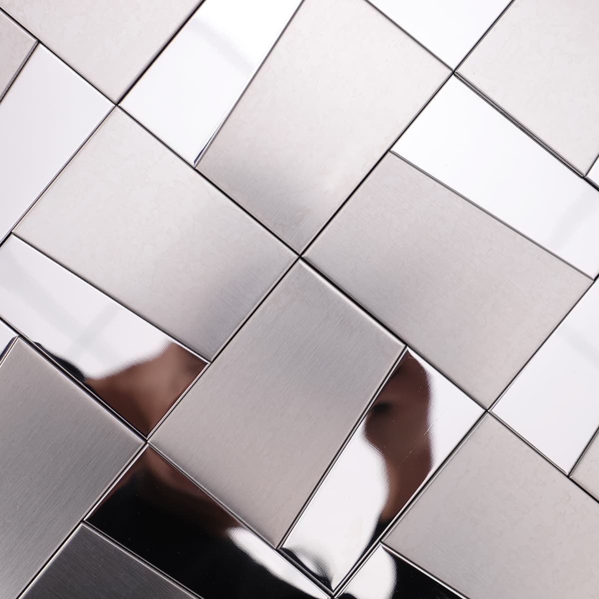 Detailed view of brushed and mirrored steel mosaic