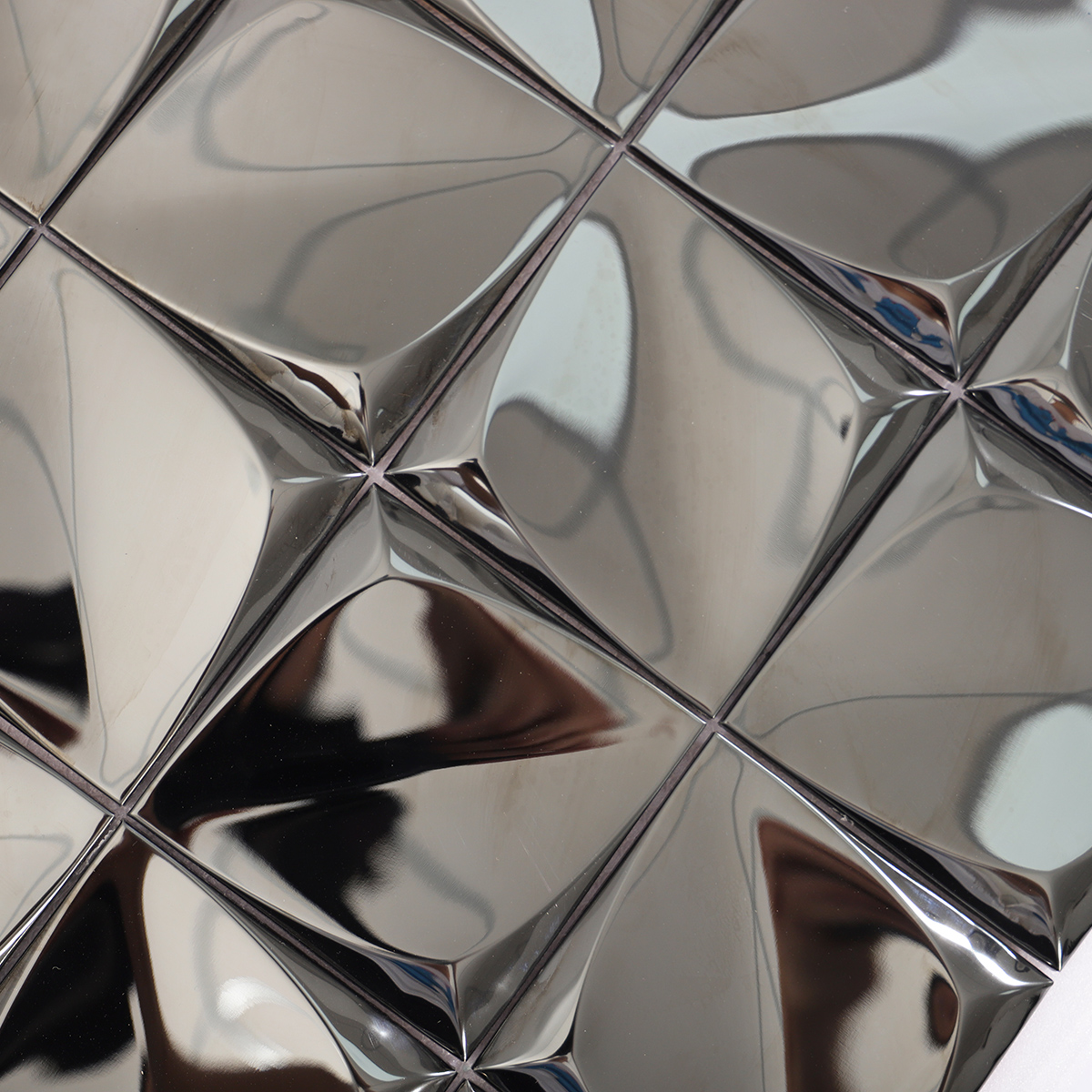 Close-up of the glossy black stainless steel surface reflecting light