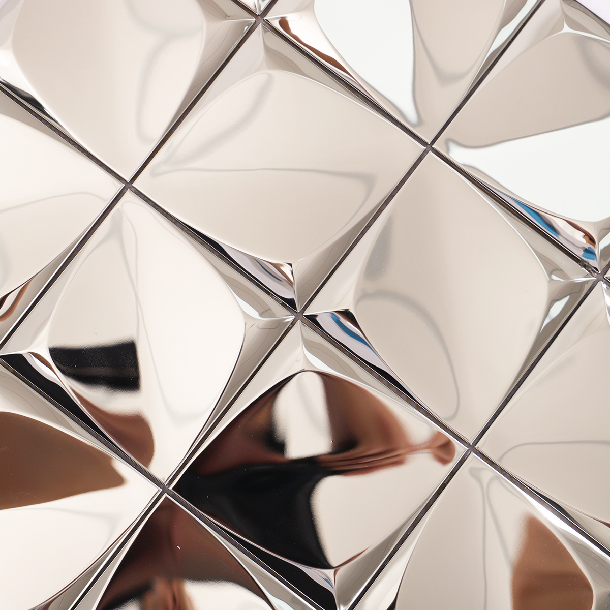 Close-up of the reflective silver finish and raised 3D design