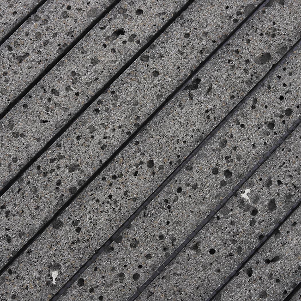 Macro view of the rugged surface and natural pores of volcanic stone tiles