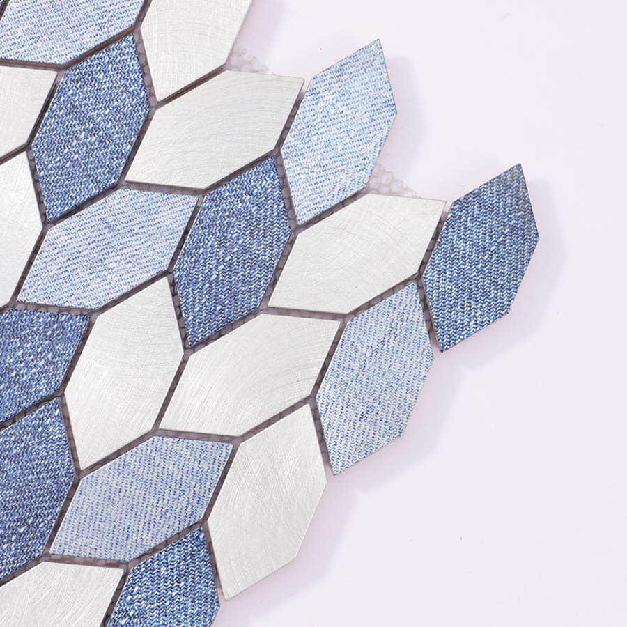 Close-up of corner edge  brushed silver and textured blue aluminum pieces.