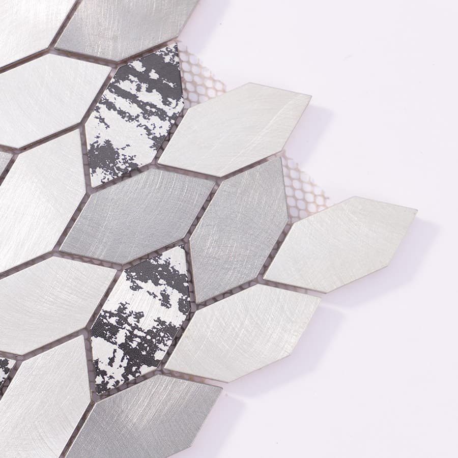 Close-up of the tile corner showing individual diamond aluminum pieces with matte and reflective textures.