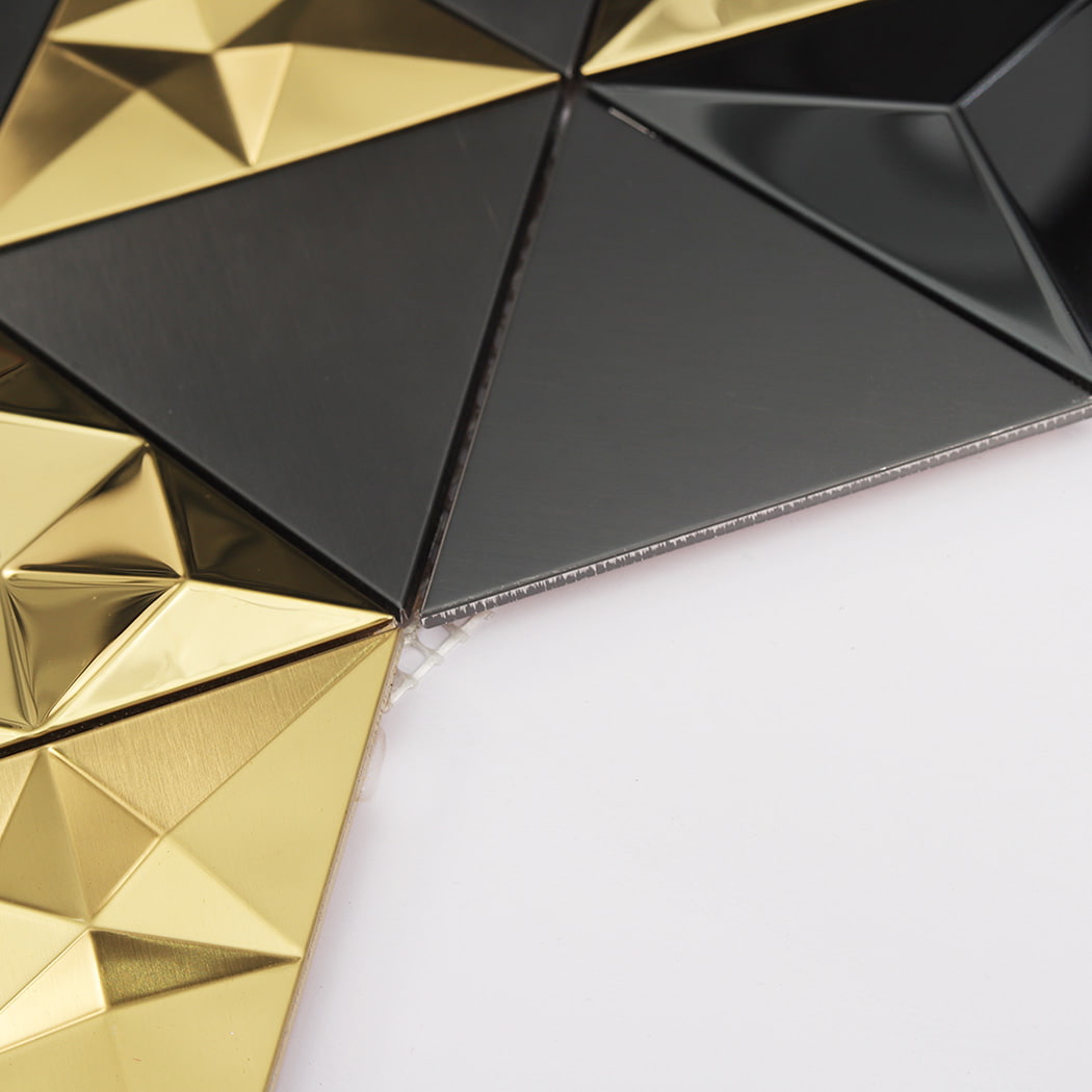 Corner view of 3D triangle metal mosaic tiles showing mesh backing and thickness