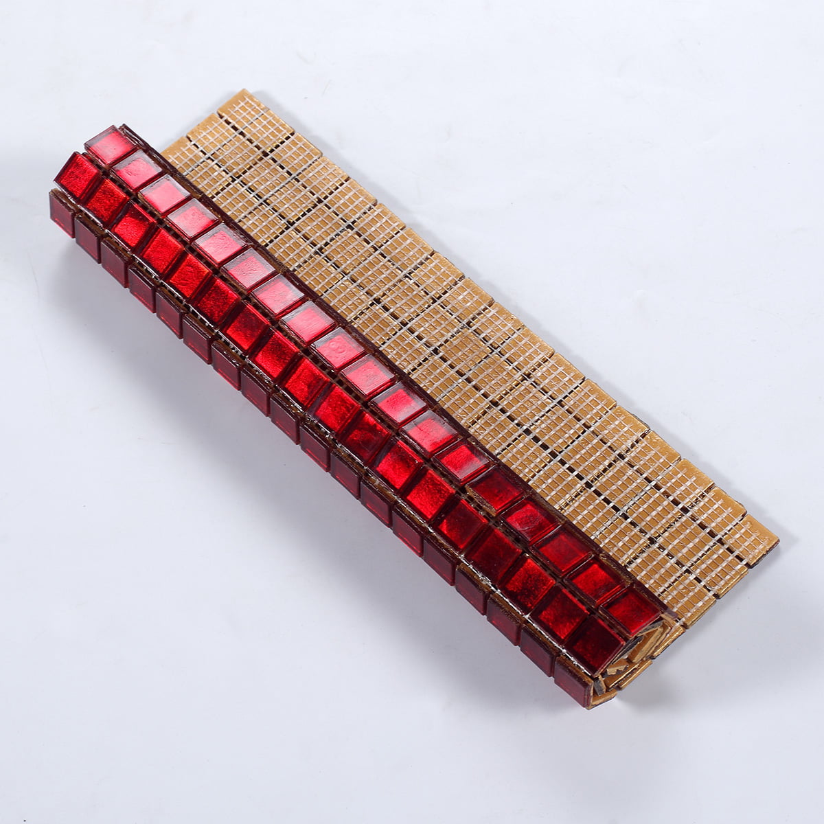 Flexible red glass mosaic tile sheet with mesh backing for easy installation on curved surfaces