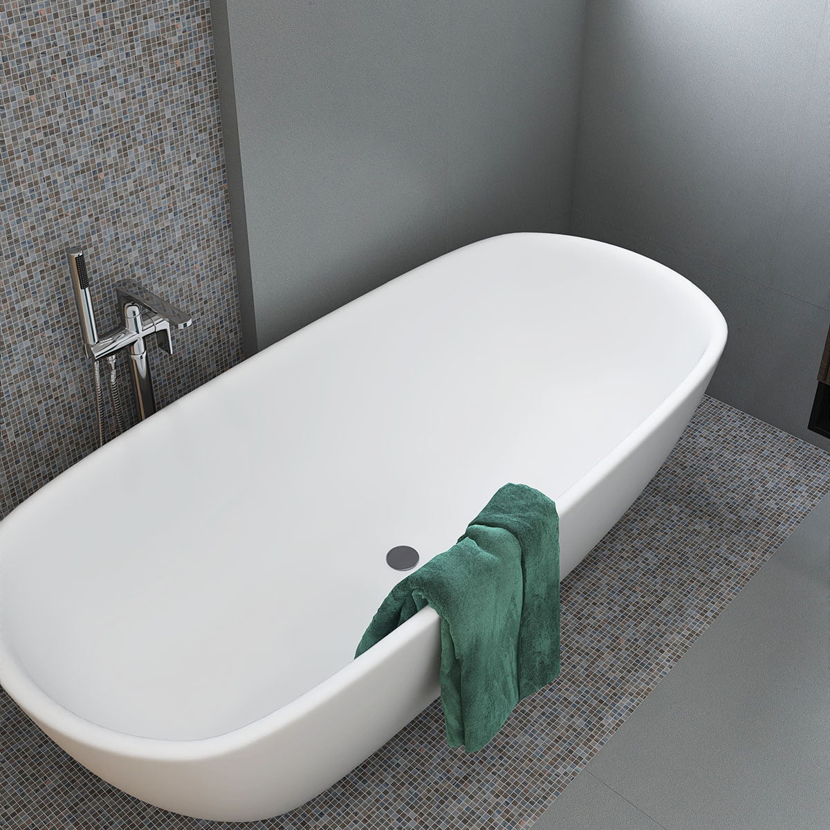 Freestanding tub with textured mosaic tile wall and floor in modern gray bathroom setting