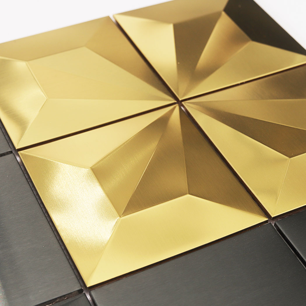 Gold 3D square mosaic close up showing pyramid facets and black tile accents