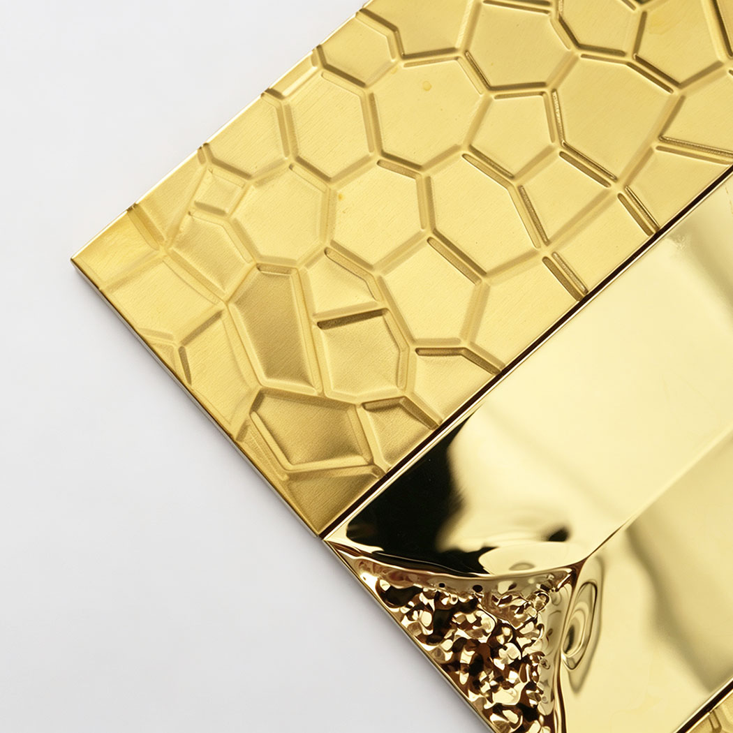 Close-up of gold 3D wall tiles in a modern mosaics pattern