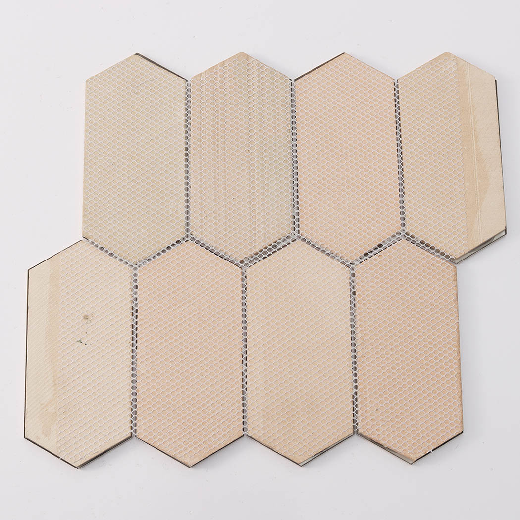 Rear view showing mesh backing of gold brushed elongated hexagon mosaic tile
