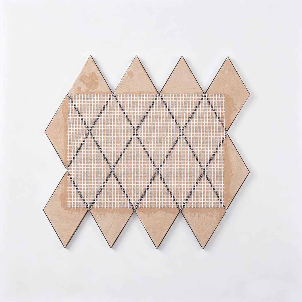 Back view of gold diamond stainless steel mosaic tile sheet with mesh backing
