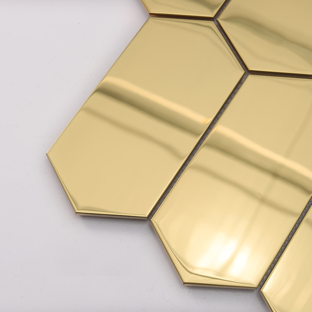 Corner close up of gold elongated hexagon mosaic tile surface