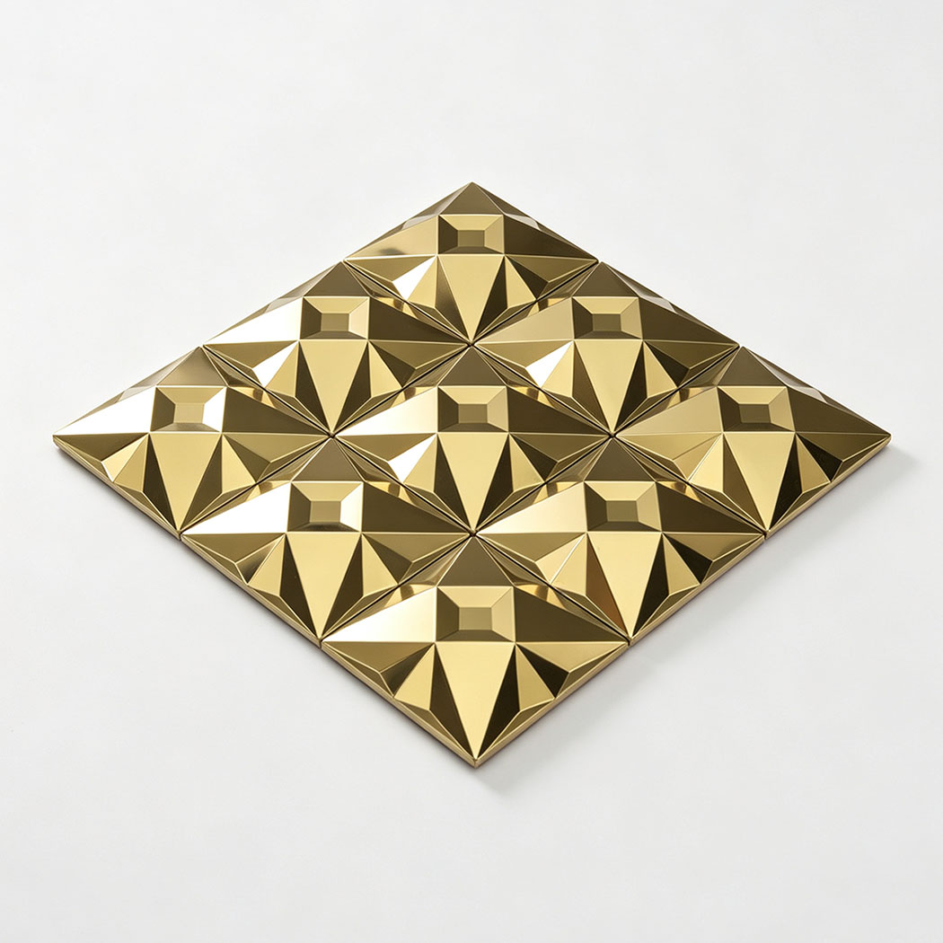 Angled view of a gold faceted stainless steel geometric mosaic tile sheet