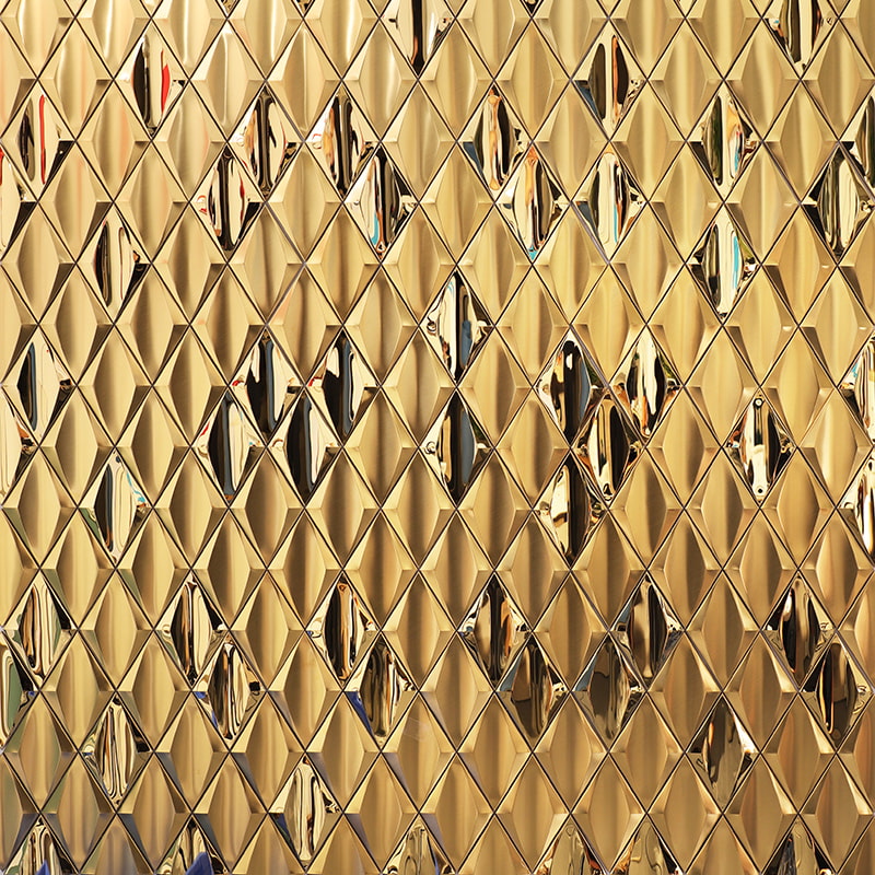 Shiny gold stainless steel tiles with a diamond pattern and reflective finish.