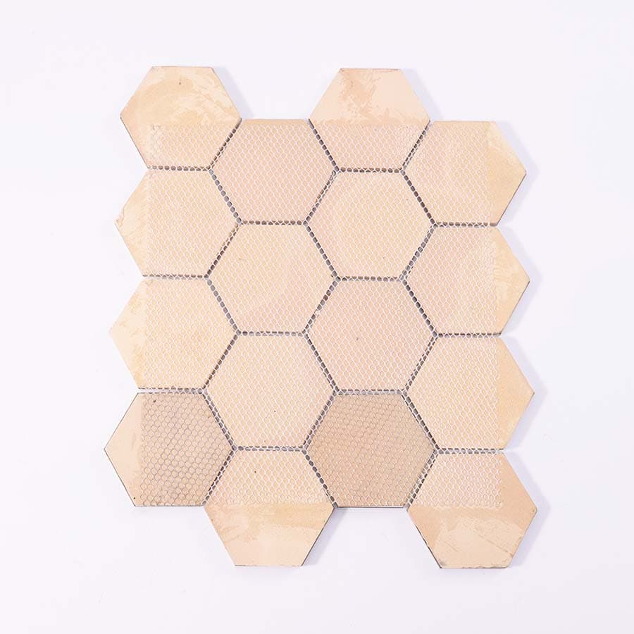 Back view of gold hexagon aluminum mosaic tile sheet with mesh backing