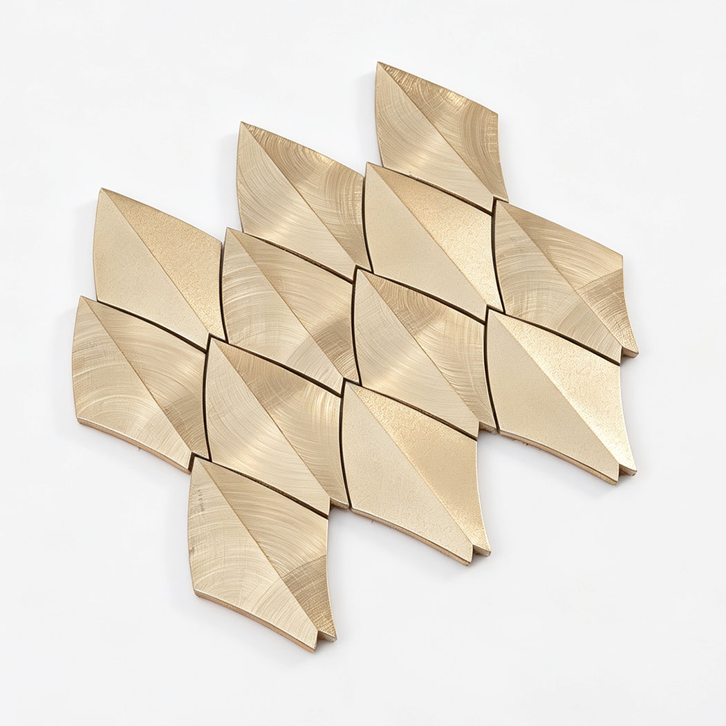 Angled view of gold leaf aluminum mosaic tile sheet on a white background