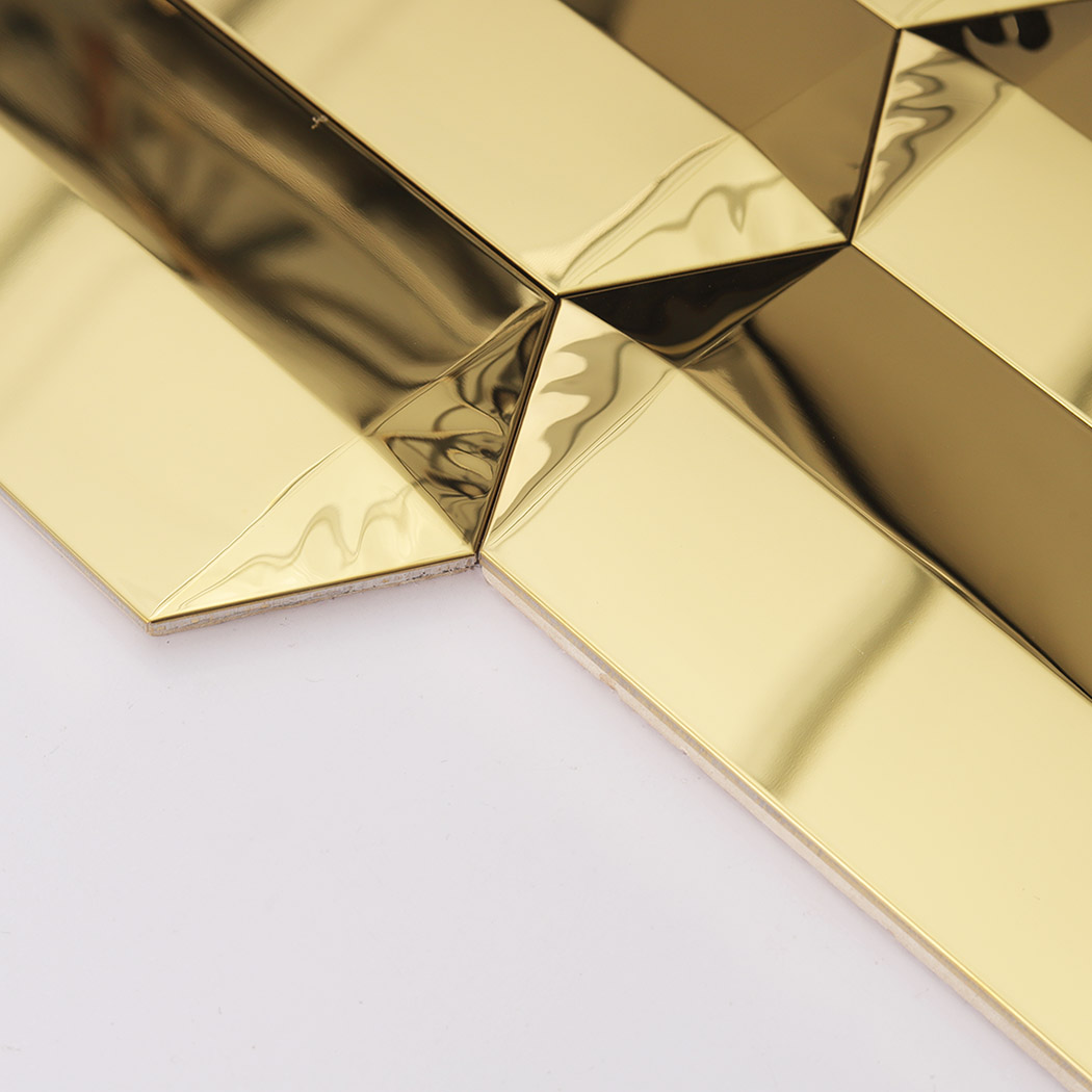 Side close up of gold mirror mosaic tile showing thickness and beveled edges