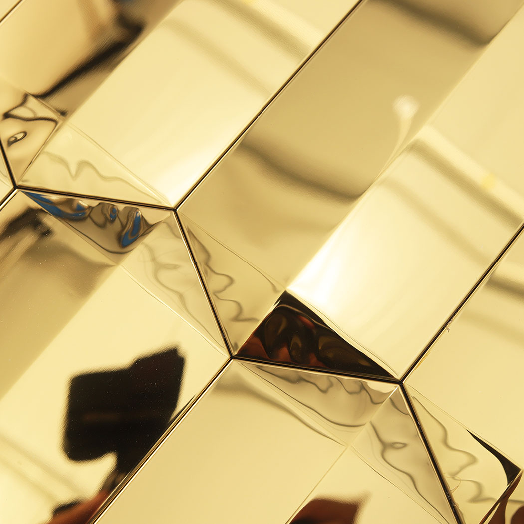 Gold mirror picket mosaic close up showing beveled joints and glossy reflections