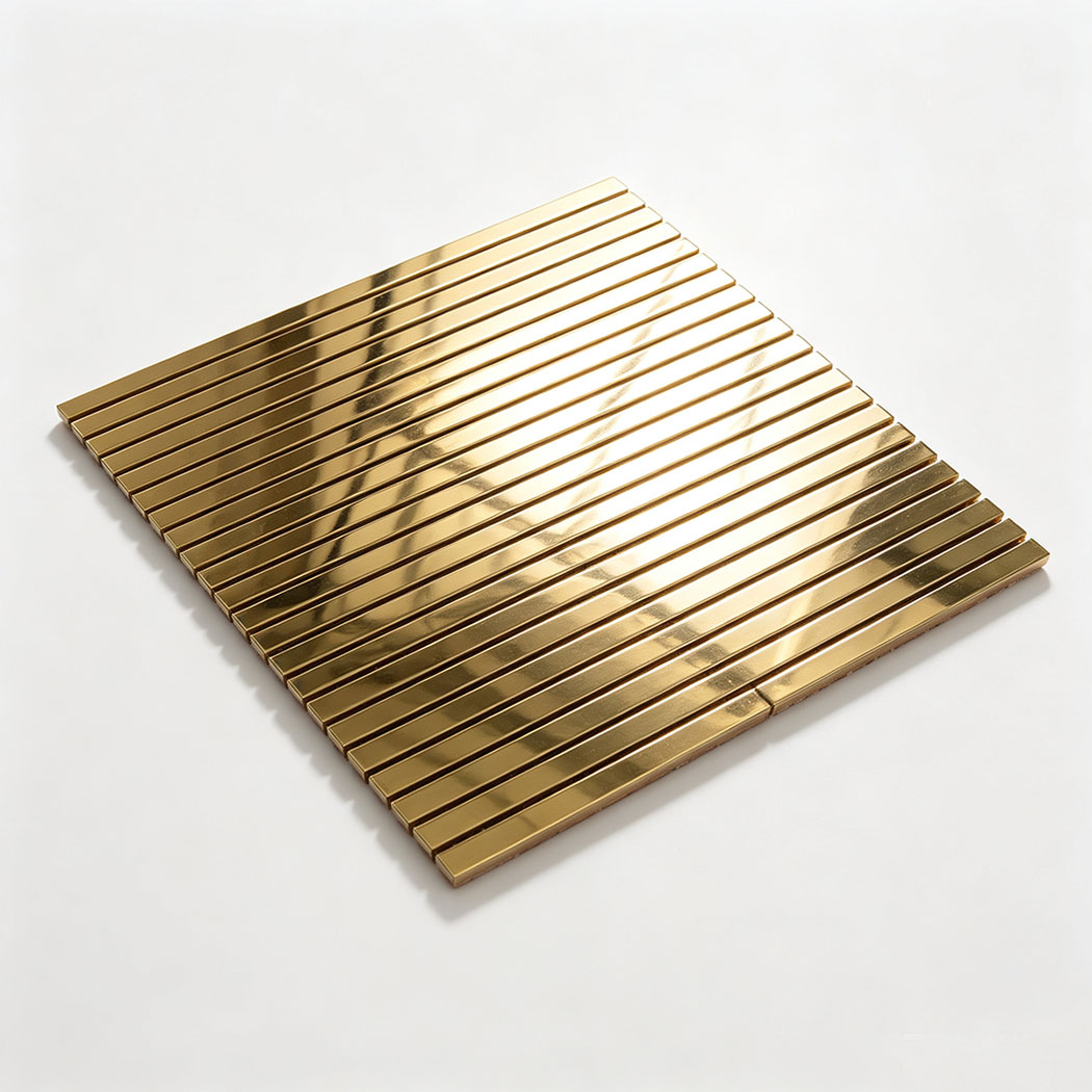 Angled view of gold mirror stainless steel ribbon tile sheet