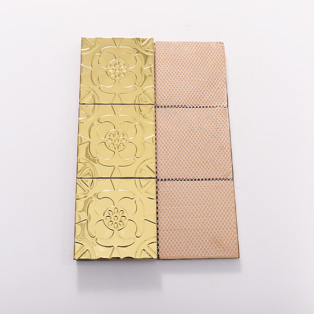 Gold embossed metal mosaic tiles shown with mesh backing for installation.