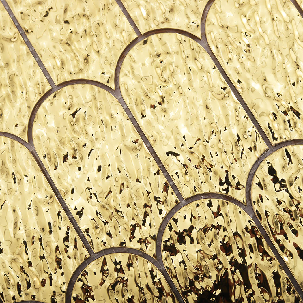 Detailed antique gold water ripple surface on scallop metal mosaic tiles