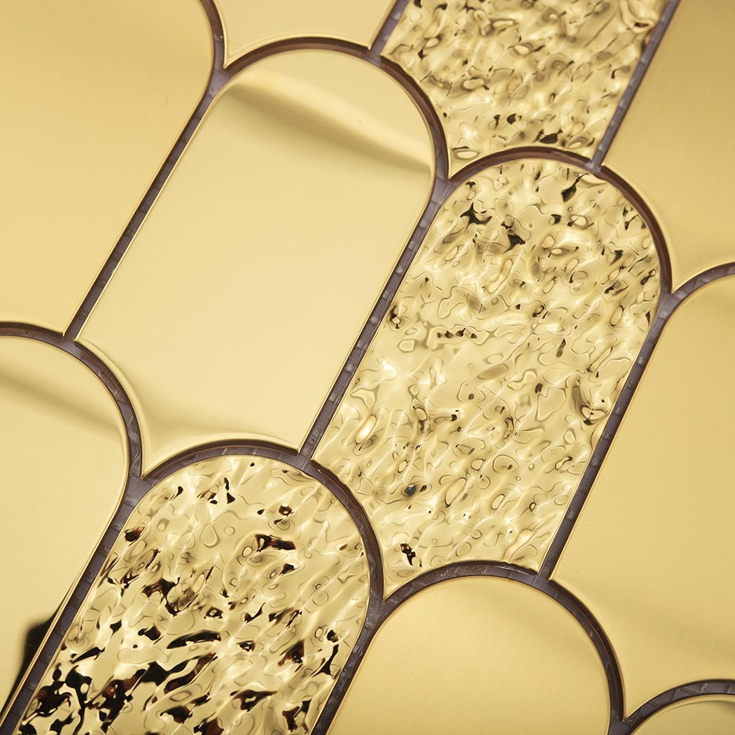 Detailed view of ripple and smooth gold fan metal mosaic tile texture
