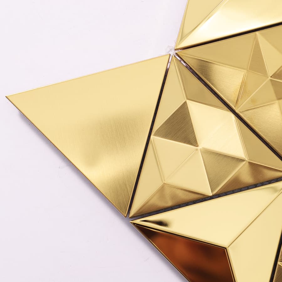 Corner section of a gold pyramid-pattern mosaic tile with a flat triangle edge.