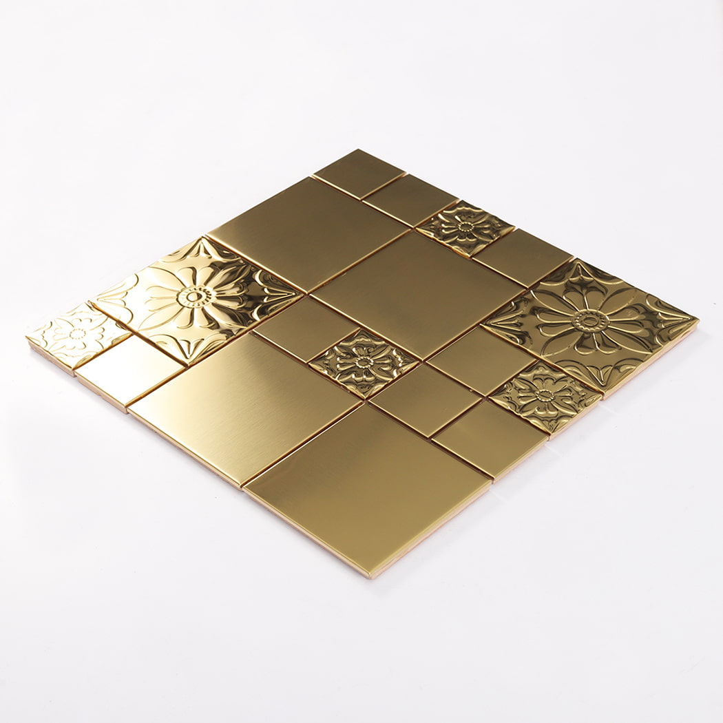 Angled view of gold embossed floral stainless steel mosaic tile sheet
