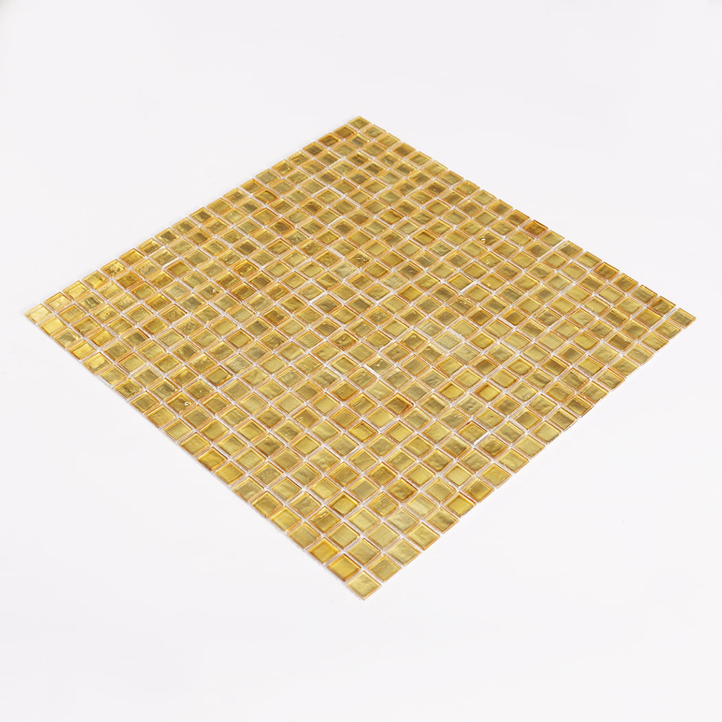 Three quarter view of gold foil glass square mosaic tile sheet on white background