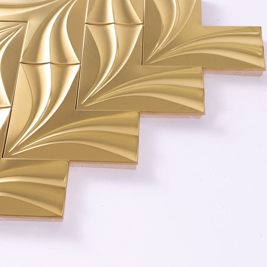 Edge view showing thickness of gold 3D herringbone metal mosaic tile
