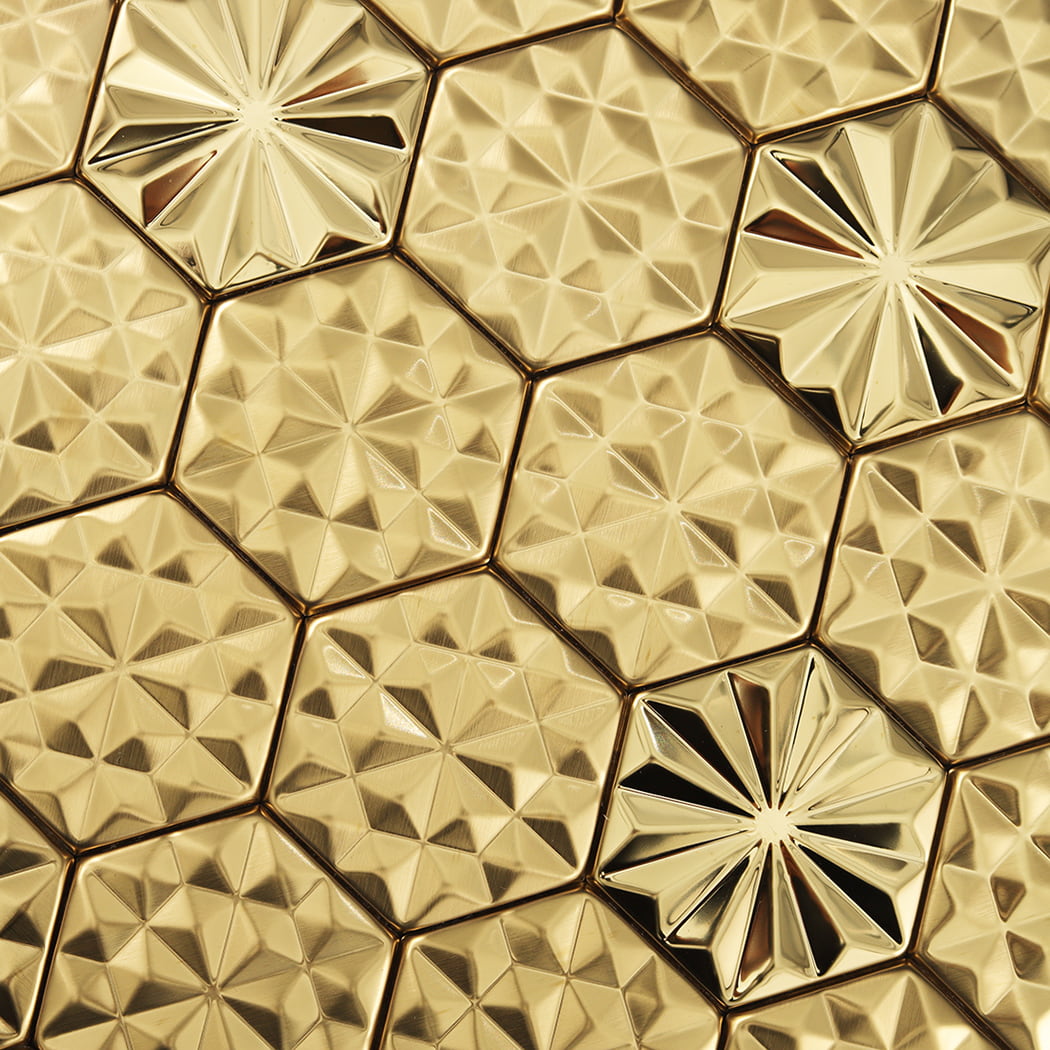 Close up of faceted geometric texture on gold hexagon metal mosaic tiles