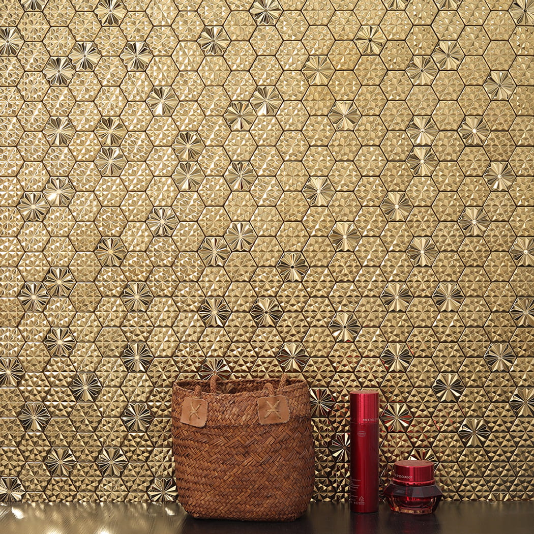 Interior decor scene featuring gold hexagon metal mosaic tile wall