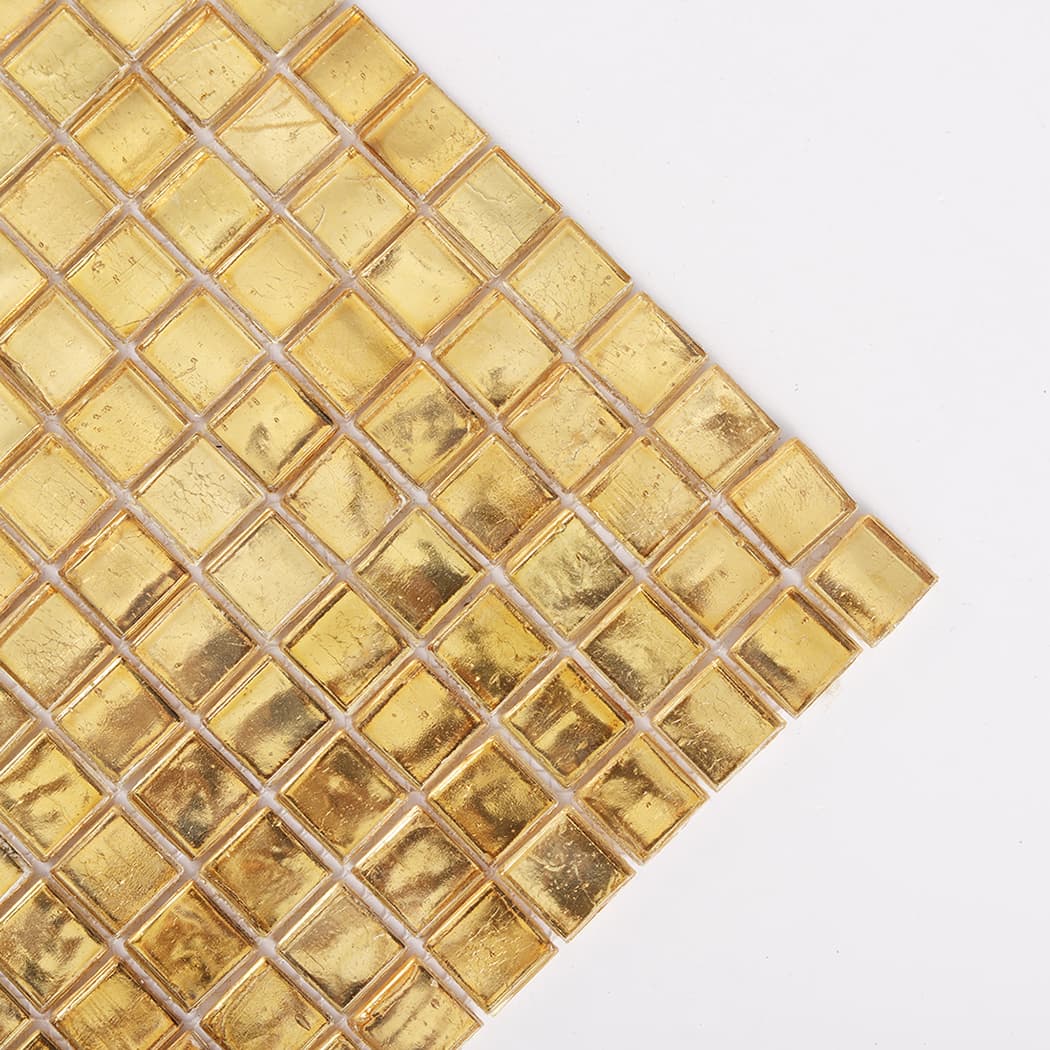 Corner close up of gold leaf glass square mosaic tile sheet