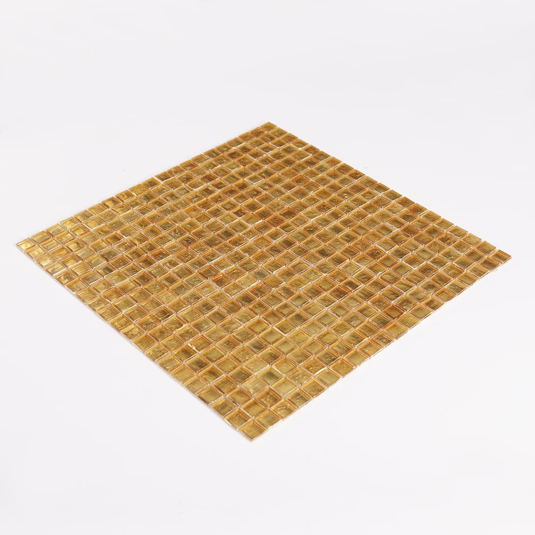 Three quarter view of gold leaf glass square mosaic tile sheet on white background