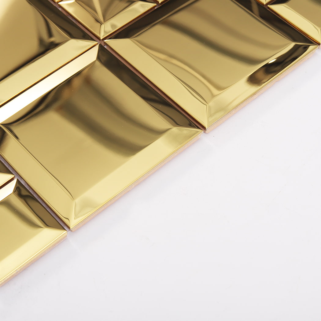 Side view of gold mirror stainless steel beveled tiles showing thickness and edge detail