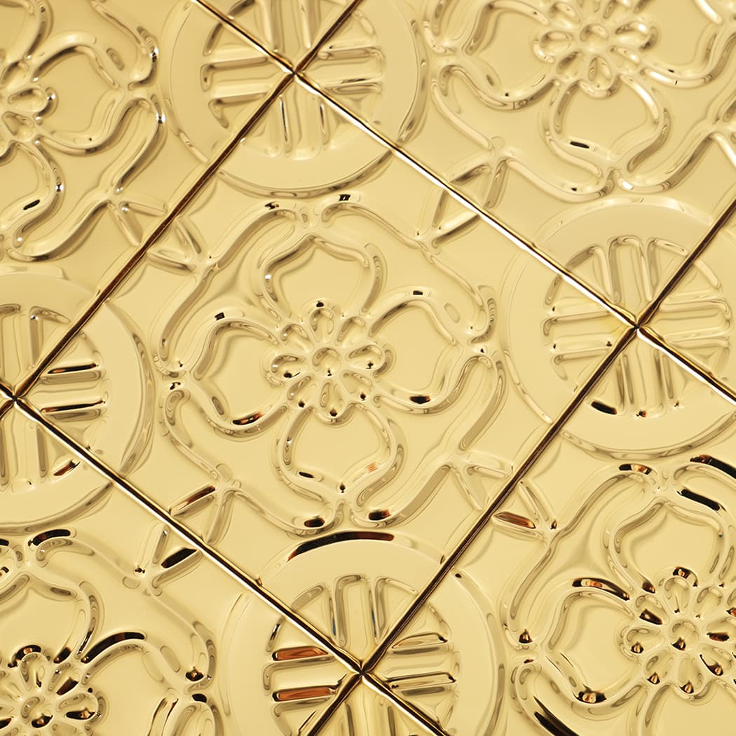 Close-up of gold square metal mosaic pattern highlighting clean seams