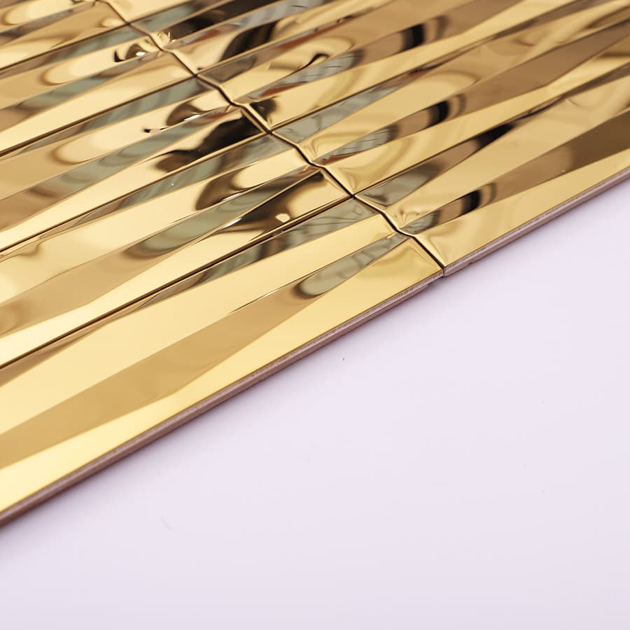 Edge view of gold stainless steel 3D wave strip mosaic tile