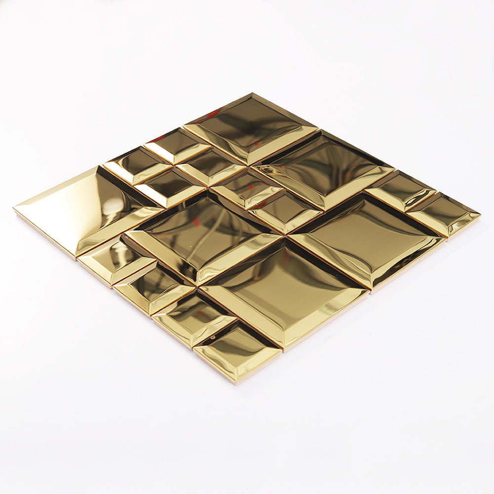 Angled view of gold stainless steel beveled square mosaic tile surface