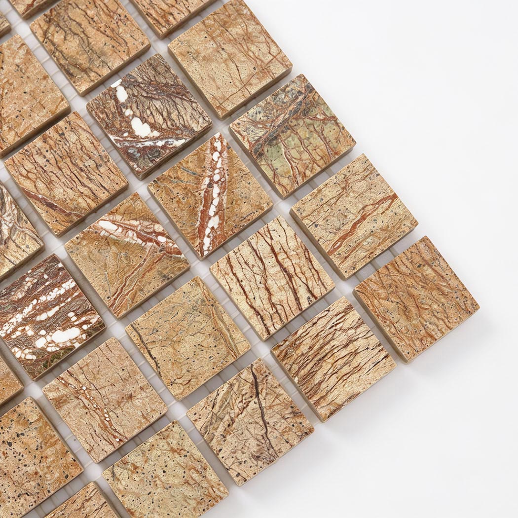 Close-up of golden brown veined marble square mosaic tiles