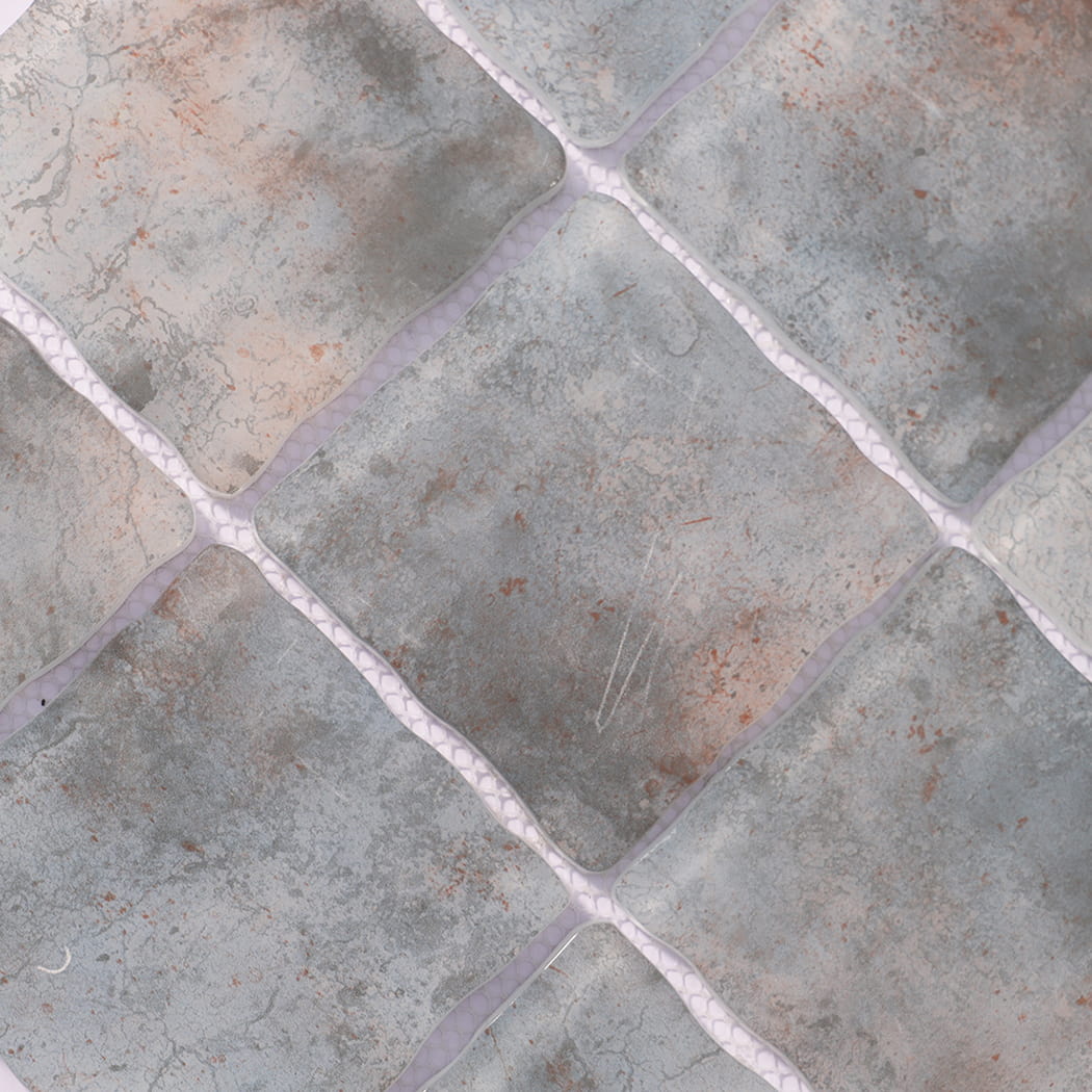 Surface detail of gray beige wavy square glass mosaic tiles