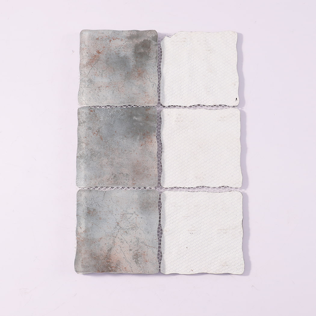 Back view of gray beige wavy square glass mosaic tiles with mesh backing